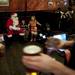 Santa sits with kids as a Conor O'Neill's waiter walks by with drinks on Sunday. Daniel Brenner I AnnArbor.com
